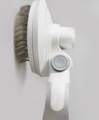 Self-cleaning wire brush for pets